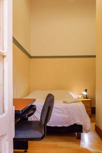 Ένα ή περισσότερα κρεβάτια σε δωμάτιο στο Hostal R10