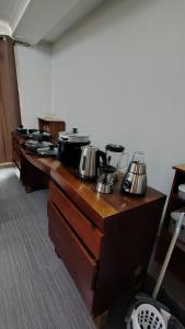 a row of counters with pots and pans on them at Seabeach residence in Belle Mare
