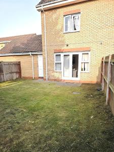 an empty yard in front of a brick house at 2ndHomeStays- Bilston- Contractors Friendly Townhouse in Bilston