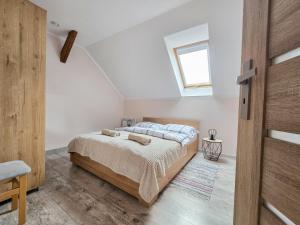 Ένα ή περισσότερα κρεβάτια σε δωμάτιο στο Apartament Komarno III +6 φωτογραφίες