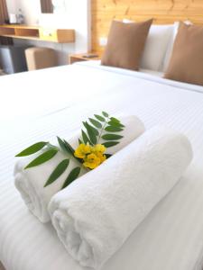 Ένα ή περισσότερα κρεβάτια σε δωμάτιο στο Legacy Inn Ella