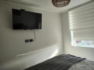 TV a/nebo společenská místnost v ubytování Céntrico en Concepción 1D 1B 1E + 11 fotografií