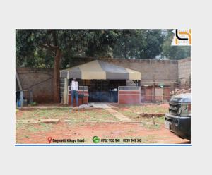 een man staat voor een tent bij BNB Lanaelt houses in Nairobi