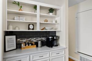 a white hutch with a coffee maker in a room at Vibrant 3BR Dallas Home, Near DFW, With Family-Friendly Amenities in Irving +31 photos
