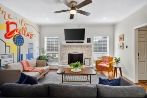 a living room with a couch and a fireplace at Vibrant 3BR Dallas Home, Near DFW, With Family-Friendly Amenities in Irving
