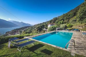 a swimming pool with a view of a mountain at Casa Sorel : Attico Lago & Pool in Pianello Del Lario