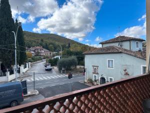 a view from a balcony of a street with a building at Dimore di Sant'Albino Montepulciano in Sant'Albino