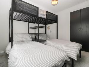 Ένα ή περισσότερα κρεβάτια σε δωμάτιο στο Lush House