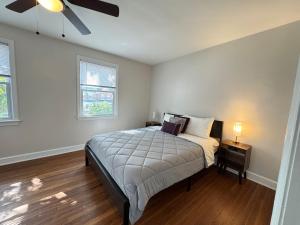 a bedroom with a bed and a ceiling fan at Spacious Cozy Entire House in DC in Washington
