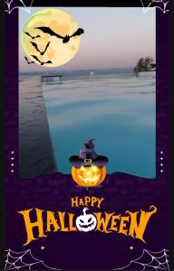 a halloween poster with a pumpkin and a hat at Nature Guesthouse in Lagos