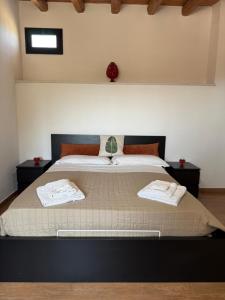 Ένα ή περισσότερα κρεβάτια σε δωμάτιο στο Tenute Cinquanta