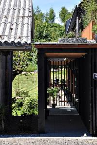 a building with a gate with a potted plant on it at Ferienwohnung Reichart in Tannenbach