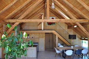 a room with a table and chairs in a barn at Ferienwohnung Reichart in Tannenbach +22 photos