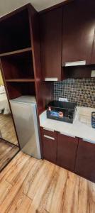 a kitchen with a counter with a toaster oven on it at GR Ming garden SCSP in Kota Kinabalu