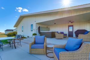 a patio with chairs and a table and a grill at Mtn Views, Hot Tub and Fire Pit Black Hills Retreat in Piedmont