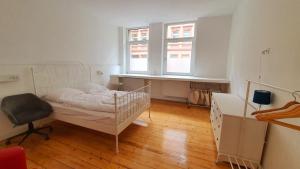 Ένα ή περισσότερα κρεβάτια σε δωμάτιο στο 3-Zimmer Wohnung