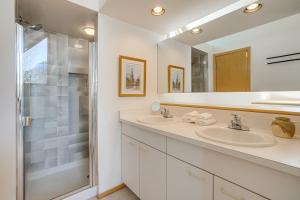 a bathroom with two sinks and a shower at Mtn-View Deck, Workspace! Walkable Frisco Condo in Frisco +18 photos