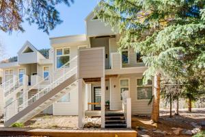 a house with a staircase in front of it at Mtn-View Deck, Workspace! Walkable Frisco Condo in Frisco