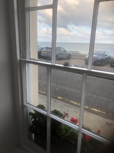 a window view of the ocean from a room at Brand new 125 square metre sea view apartment in Deal