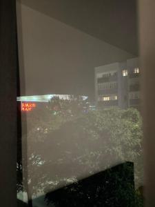 a view from a window of a city at night at Apartament Noniewicza 95 in Suwałki