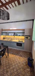a large kitchen with a sink and a stove at Pipa Alquiler Temporal in Resistencia +16 photos