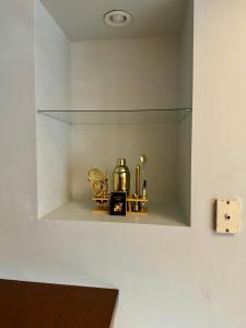 a glass shelf with items on it in a room at Free Parking - Prime Location - Downtown in Columbus