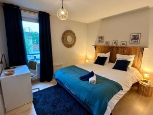 Postel nebo postele na pokoji v ubytování Le Patis