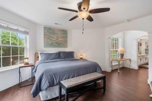 a bedroom with a bed and a ceiling fan at Lake Hideaway - Waterfront Condo with Resort Perks in Kimberling City