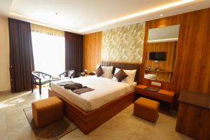 Voodi või voodid majutusasutuse BK Garden Hotel and Resort toas