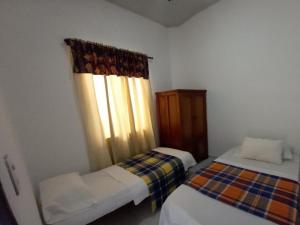 Krevet ili kreveti u jedinici u okviru objekta Apto 4 cuartos Valencia centro Histórico Popayán