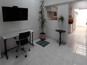 TV i/ili multimedijalni sistem u objektu Apto 4 cuartos Valencia centro Histórico Popayán +9 fotografija