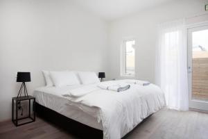 Ένα ή περισσότερα κρεβάτια σε δωμάτιο στο Nordurey Hotel City Garden