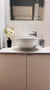 a bathroom with a bowl sink on a counter at Côté Jardin - 3 people - Netflix in Melun
