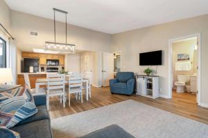 a living room with a table and a dining room at Lakeview At Table Rock in Kimberling City +23 photos