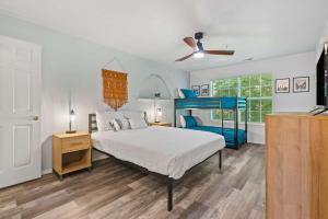 a bedroom with a bed and a blue bunk bed at Spring Creek Escape - Balcony with Views in Branson
