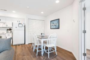 a kitchen and dining room with a table and chairs at Boatin & Floatin on Table Rock Lake in the Ozarks in Kimberling City
