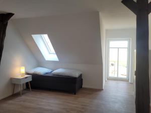 Ένα ή περισσότερα κρεβάτια σε δωμάτιο στο Heidehof Kuppendorf