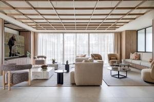 a living room with a couch and a table at Calido Valdebebas in Madrid