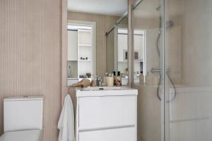 a bathroom with a sink and a shower at Calido Las Tablas in Madrid