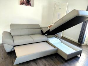 a living room with a couch and a loft bed at Anchorage Accommodation in Balloch +36 photos