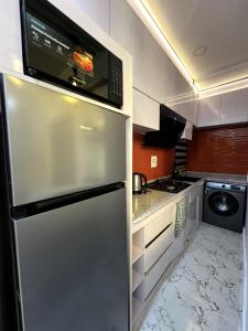 Kuchyň nebo kuchyňský kout v ubytování Pat Luxury Apartments + 39 fotografií