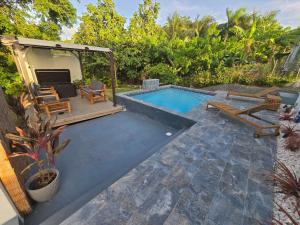 a backyard with a swimming pool and a patio at Casa Anastasia Beachside Villa with Pool in Vieques