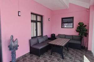 a living room with a couch and a table at Charming Villa with Pool in Souillac in Souillac