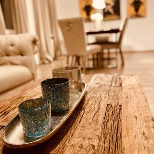 a tray with three cups on a wooden table at Mainglück in Seligenstadt +10 photos