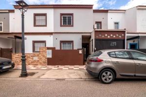 a car parked in front of a house at El Rincón de Doñana in Villamanrique de la Condesa
