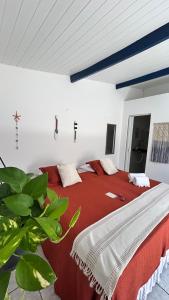 Ένα ή περισσότερα κρεβάτια σε δωμάτιο στο Suítes Canoa Azul