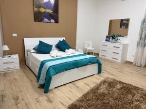 Giường trong phòng chung tại Roan home Pompei +9 ảnh