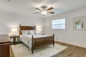 a bedroom with a bed and a ceiling fan at Pet-Friendly Duplex with Large Yard in Fort Myers! in Fort Myers