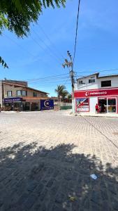 an empty street in front of a store at Suite Canoa azul 1 in Aracati +4 photos