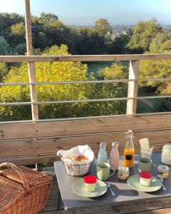 a tray of food on a table on a balcony at La Carriair in Pont-Aven